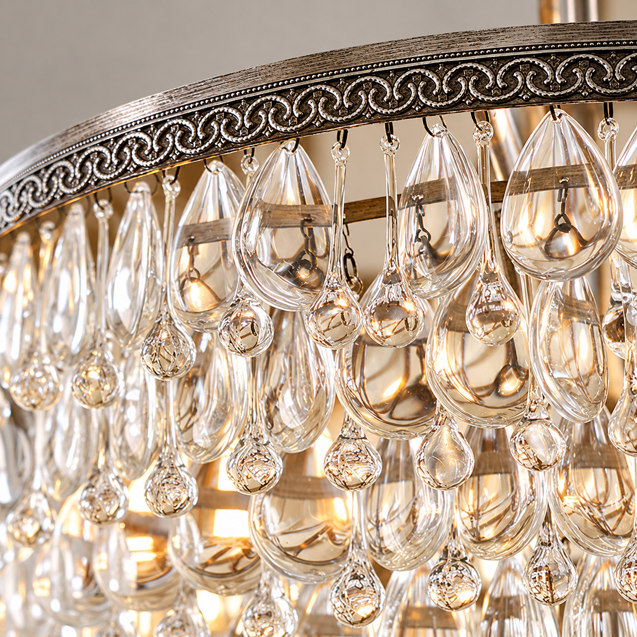 Clear teardrop glass crystals and decorative silver filigree frame