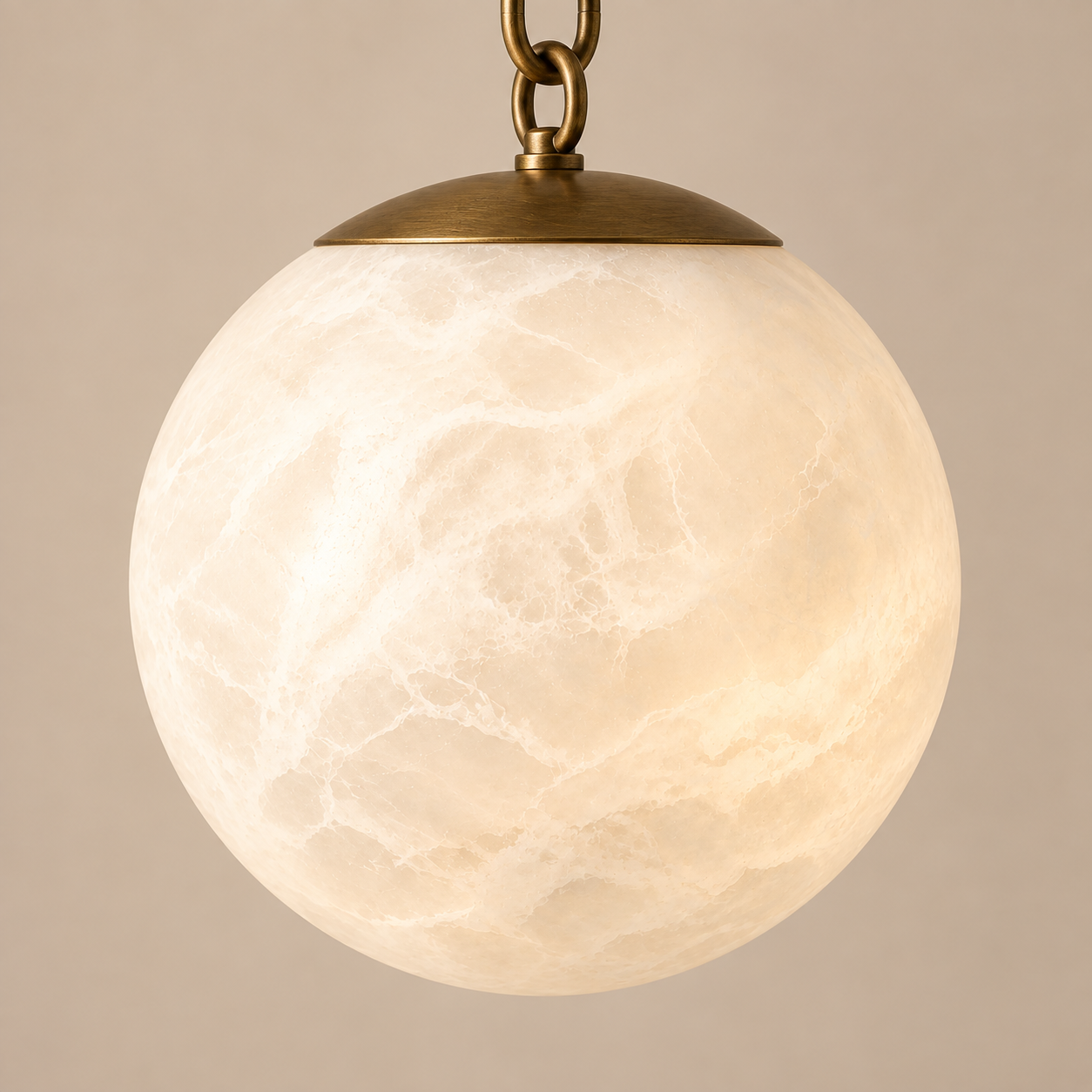 Alabaster globe pendant light with antique brass chain
