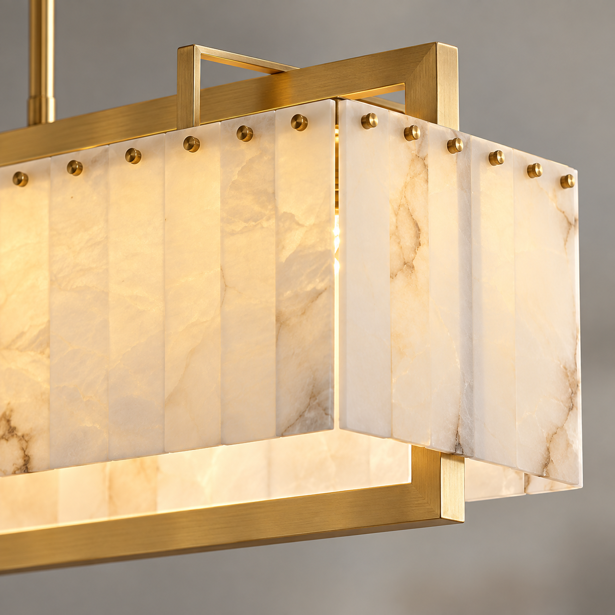 Natural alabaster panels with brass mounting details